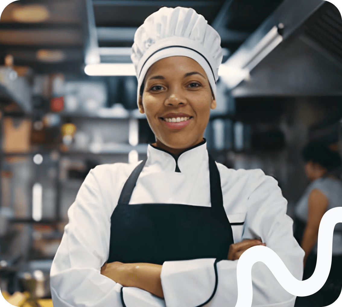 A chef standing in a commercial kitchen